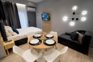 a small living room with a table and a couch at Preveza Central Stay in Preveza +118 photos