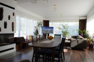 a living room with a table and a couch at Vila Bella in Oradea