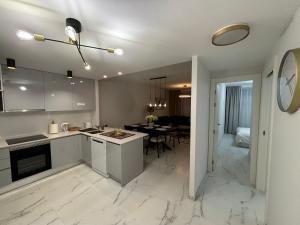a kitchen and living room with a table in a room at Flamenca Village- Apartment 459 in Orihuela Costa