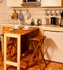 a kitchen with a wooden island in a kitchen at Kaj's Cabin in Listerby