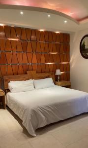 En eller flere senge i et værelse på Casa Diamante Hotel Boutique - Mineral de Pozos