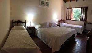 Postel nebo postele na pokoji v ubytování Posada Tupasy + 2 fotografie