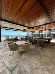 En restaurant eller et andet spisested på NoMAR Premium - Tamandaré Carneiros