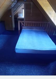 En eller flere senge i et værelse på Domek letniskowy u Doroty