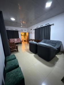 a living room with two couches and a couch at lakshi's place in Ambalangoda