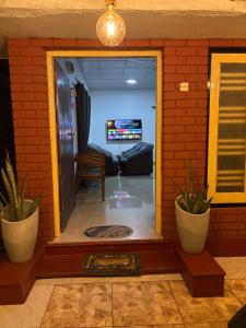 a living room with a door open to a living room at lakshi's place in Ambalangoda +4 photos