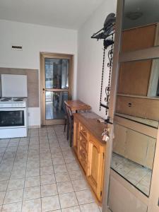 a kitchen with a table and a stove top oven at Nature Nest Više Selo in Blace +9 photos