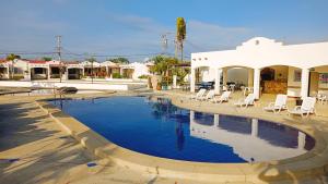 a swimming pool in the middle of a town at Riveri Salinas V53 in Salinas