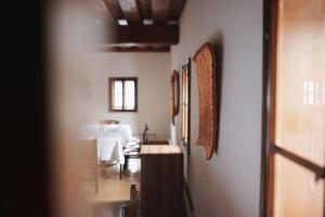 a room with a table and a dining room at Mesnerhaus & Gourmetrestaurant Mesnerhaus mit 4 Hauben in Mauterndorf +57 photos