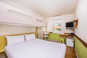 Postel nebo postele na pokoji v ubytování ibis Budget - Newcastle