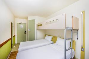 Postel nebo postele na pokoji v ubytování ibis Budget - Newcastle