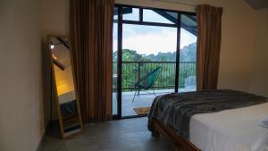 Postel nebo postele na pokoji v ubytování Divan Jungle Lodge