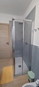 a shower with a glass door in a bathroom at Re Di Coppe in Torre Boldone +15 photos