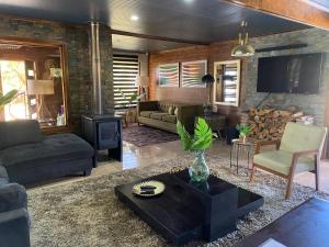 Posezení v ubytování Casa con 2 Piscinas y Cama elástica