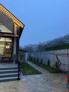 a house with a patio with lights on it at Sultan Villas A-Frame in Quba in Quba