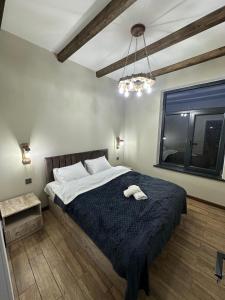 a bedroom with a large bed and a window at Sultan Villas A-Frame in Quba in Quba +22 photos