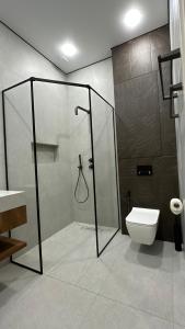 a bathroom with a shower and a toilet at House In Dilijan in Dilijan