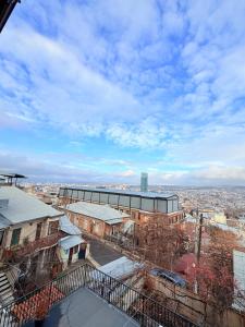a view of a city from the top of a building at Cosy City-View Flat in Mtatsminda, flat 6 in Itʼkhvisi