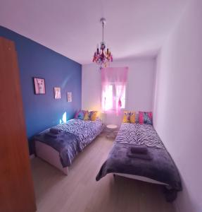 En eller flere senge i et værelse på Casa cruce de los molinos