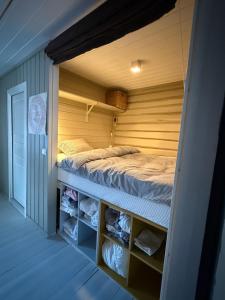 En eller flere senge i et værelse på Nordre Fossheim Gård Hemsedal