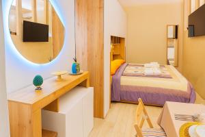 En eller flere senge i et værelse på Severino Sweet Home