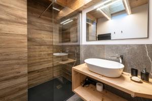 a bathroom with a sink and a shower at - Piz Boe - Canazei center app. in Canazei +35 photos