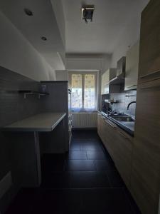 a kitchen with a sink and a counter top at Narni Come a casa dei nonni in Fiaiola