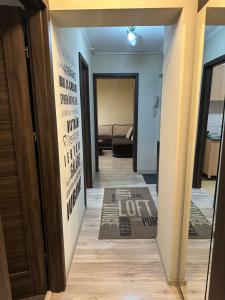 a hallway with a letting sign on the wall at Republicii Central in Ploieşti