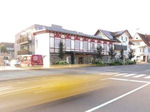 a building on the side of a city street at Hotel Linde-Sinohaus in Lustenau
