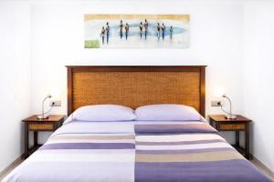 Giường trong phòng chung tại Casa Médano 34