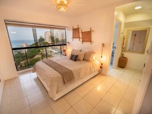 Postel nebo postele na pokoji v ubytování Beach front 9 min to airport DosLocosDeViaje + 31 fotografií