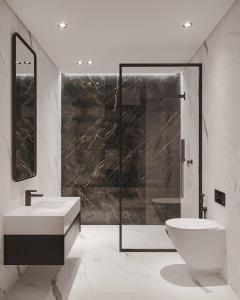 een badkamer met wastafel, douche en toilet bij Dar Bärjel in Djerba