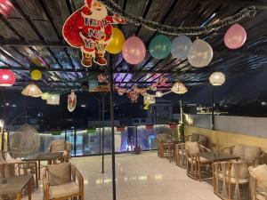a banquet hall with balloons and tables and chairs at Bedouin Camp pyramids view INN in Cairo