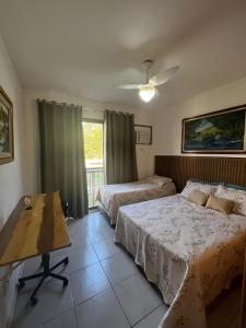 En eller flere senge i et værelse på Condado - Condomínio Aldeia dos Reis - Sahy - BL03 AP101