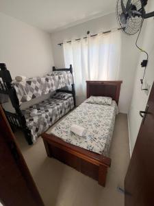 Ein Bett oder Betten in einem Zimmer der Unterkunft Casa de Praia Vila do Peró + 7 Fotos