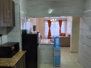 Køkken eller tekøkken på Zenaworld Stay Rongai + 19 billeder