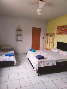 En eller flere senge i et værelse på Aquarela Suítes