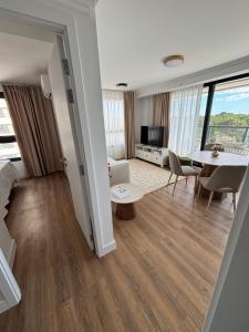 a living room with a couch and a table at Sea Garden Tower 2 in Punta del Este