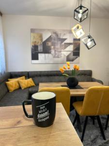 a coffee cup sitting on top of a table at Hram View Apartment, Valjevo Center in Valjevo