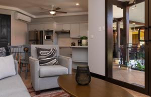 a living room with a couch and a table at Corteza 2BD Gated AC Quiet Terrace Pools in Jacó
