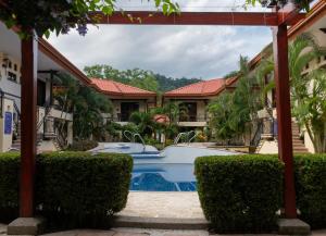 a pool in the courtyard of a house at Corteza 2BD Gated AC Quiet Terrace Pools in Jacó