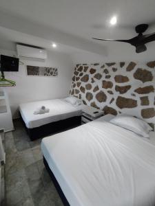 En eller flere senge i et værelse på Casa Breizh