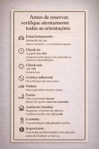 een wit bord met een lijst van apparaten bij Paraíso das Flores Suíte Confort in Socorro