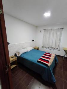 En eller flere senge i et værelse på Depto 2 amb Comodo y tranquilo