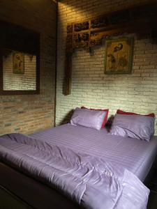 Postel nebo postele na pokoji v ubytování Merapi Farmstay + 3 fotografie