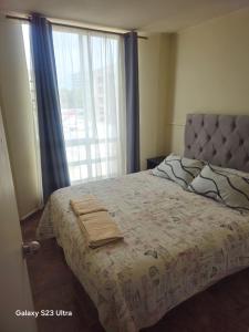 En eller flere senge i et værelse på apartamento playa 4 esquinas