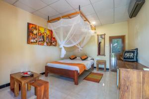 a bedroom with a bed with a mosquito net at Wild Breeze in Tissamaharama +47 photos