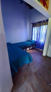 a room with two beds and a window at La Soñada in Miramar +5 photos