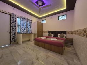 a bedroom with a bed and a purple ceiling at The Street Homestay-600m from Taj Mahal in Agra