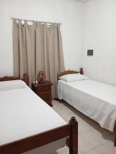 En eller flere senge i et værelse på Casa Daia con cochera y piscina